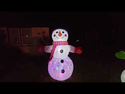 animated snowman inflatable: COMIN 8 FT Christmas Inflatable Snowman Shaking Hand with Built-in LEDs shown during my hands-on review